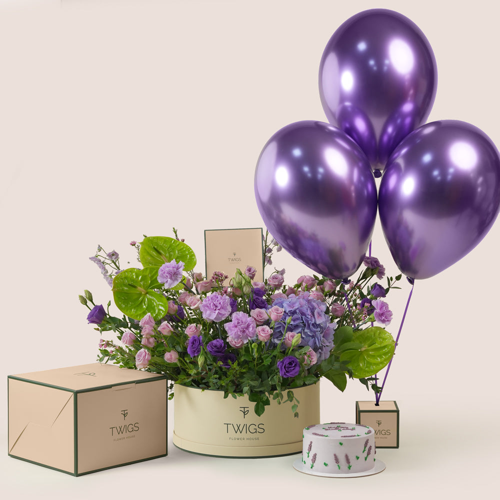 Purple flowers gift set with green anthurium, birthday cake, and purple chrome balloons by TWIGS