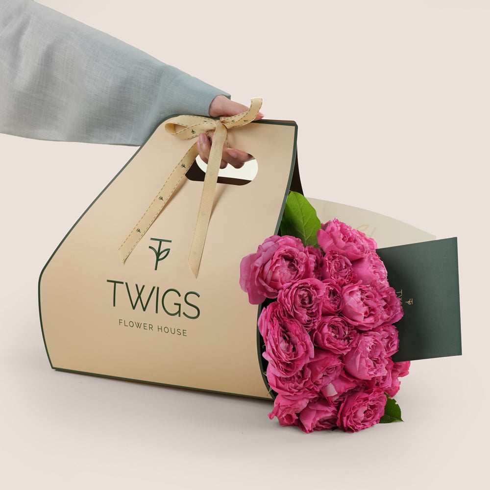 Premium pink roses with birthday cake twigs dubai