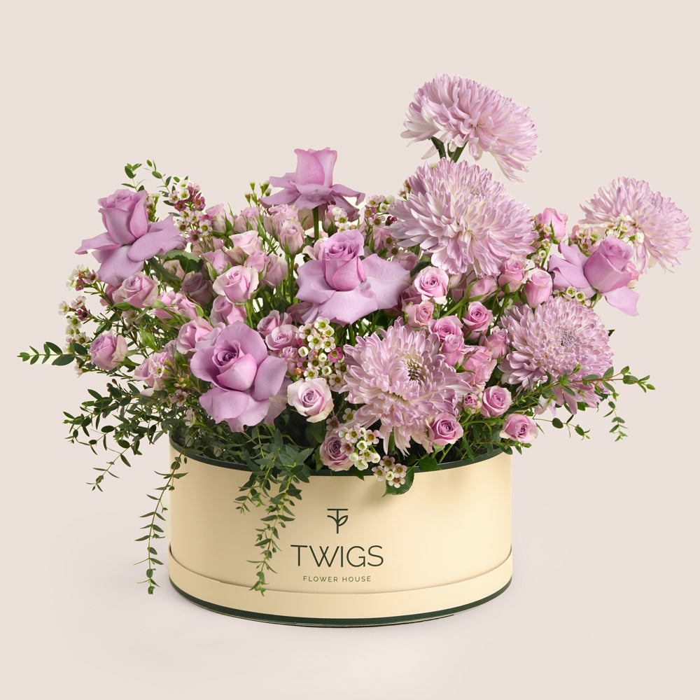 Emirati Women's Day lavender roses and purple chrysanthemums arranged in a TWIGS Grande round box, Green and Beige options