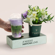 TWIGS matcha drink with a small bouquet of flowers 