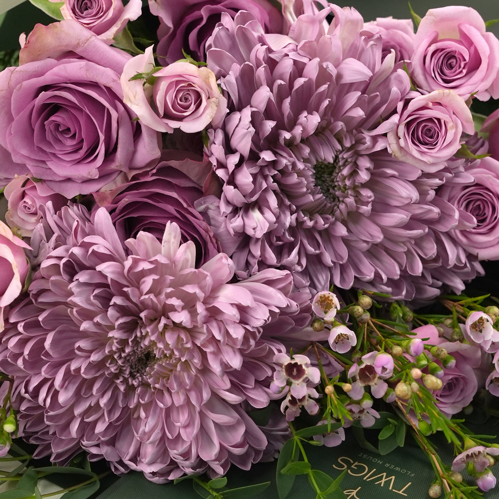 Emirati Women's Day lavender roses and purple chrysanthemums hand-tied bunch in a TWIGS bag, Green and Beige options