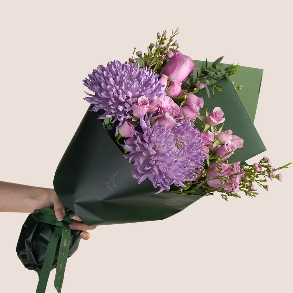 Emirati Women's Day lavender roses and purple chrysanthemums arranged in a TWIGS cone bag, Green and Beige options