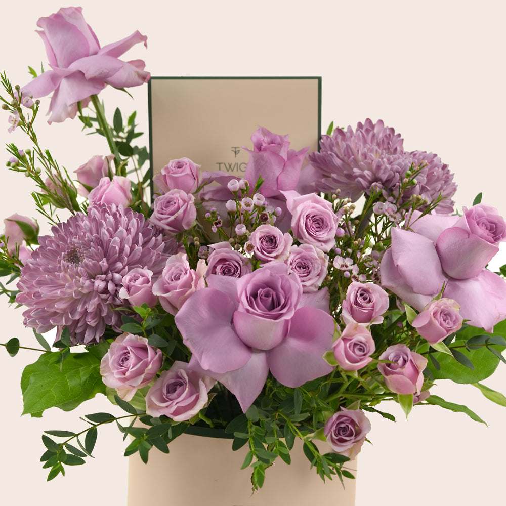 Emirati Women's Day lavender roses and purple chrysanthemums arranged in a TWIGS Deluxe round box, Green and Beige options