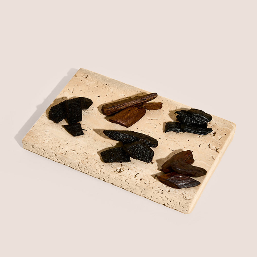 Five Tuba bakhoor compartments labeled Hala, Mizla, Afna, Talia, Inara in open brown box, TWIGS x Light of Sakina collaboration