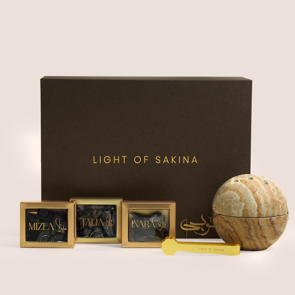 Decorative items with 'Light of Sakina' branding on a beige background