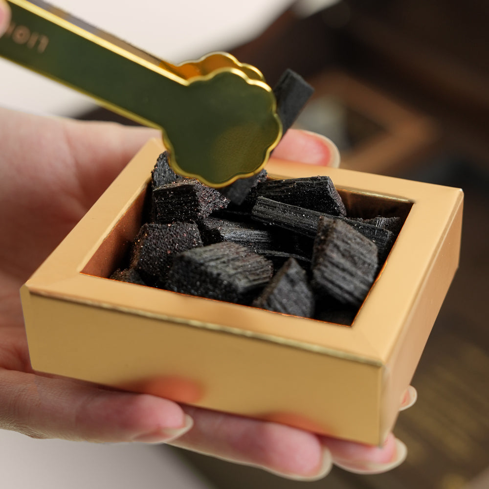 TUBA Jelani bakhoor set with stone mabkhara and gold tongs in open brown gift box, TWIGS x Light of Sakina collaboration