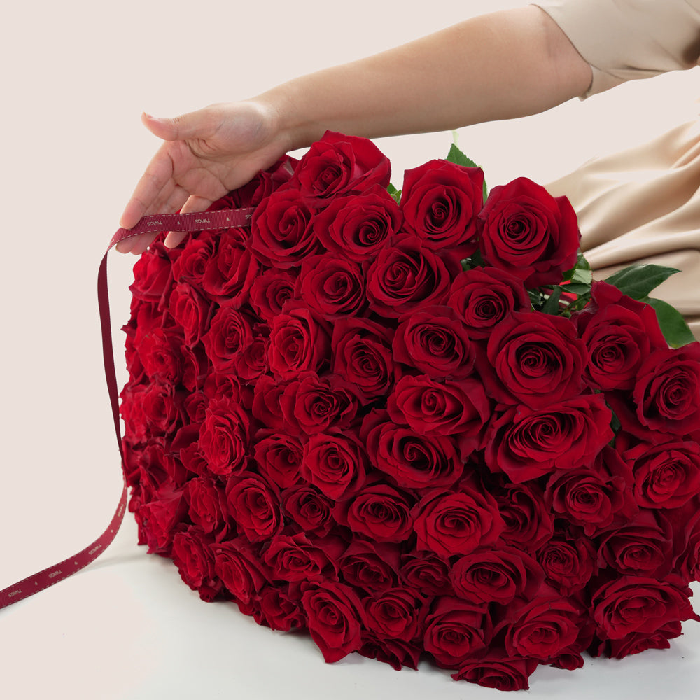 Luxury 100 stems red roses bouquet with elegant ribbon in Dubai