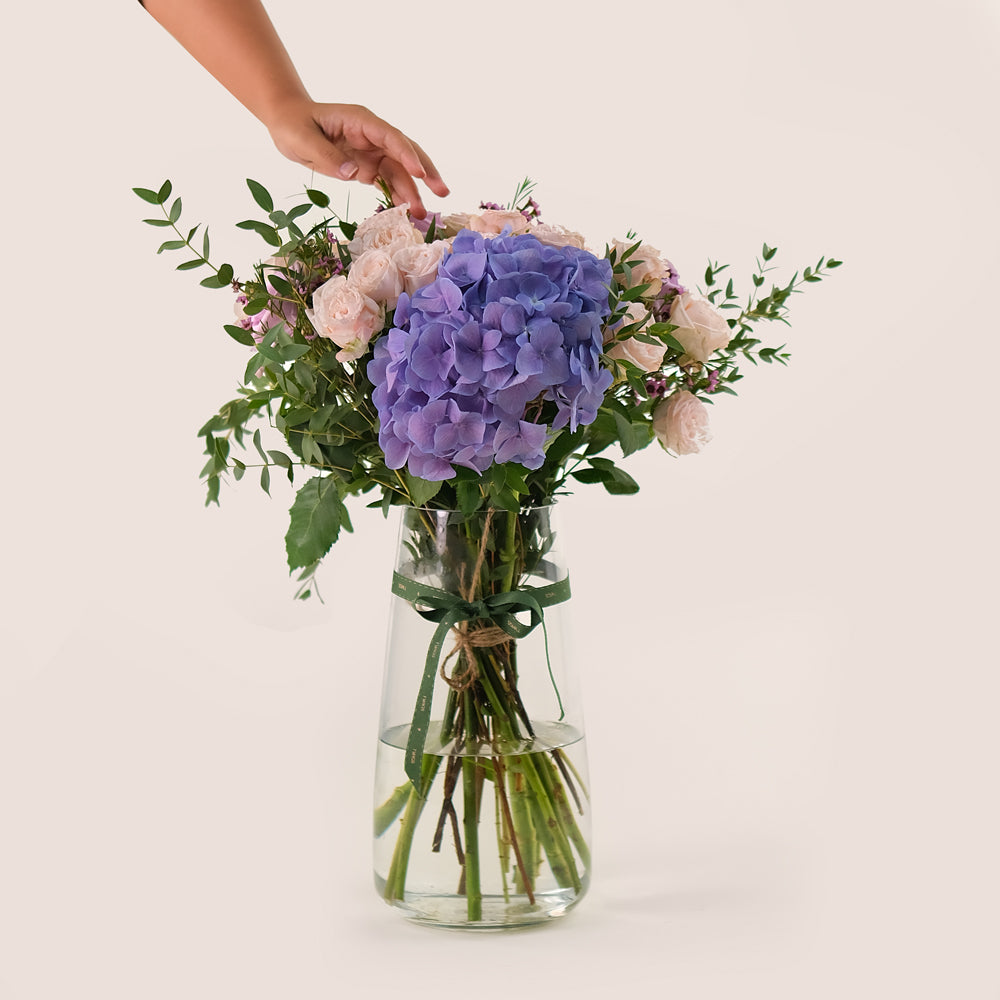 Lavender Elegance in a Flower Vase – A Refined Mix of Purple Hydrangea, Roses, and Wax Flowers