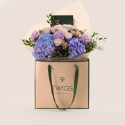 Purple Hydrangea & Rose Hand Bouquet – Soft Elegance in a Chic Flower Gift Bag