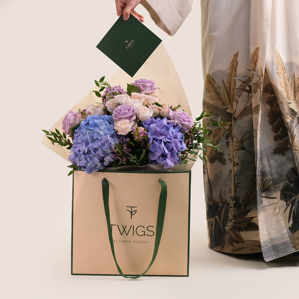 Purple Hydrangea & Rose Hand Bouquet – Soft Elegance in a Chic Flower Gift Bag