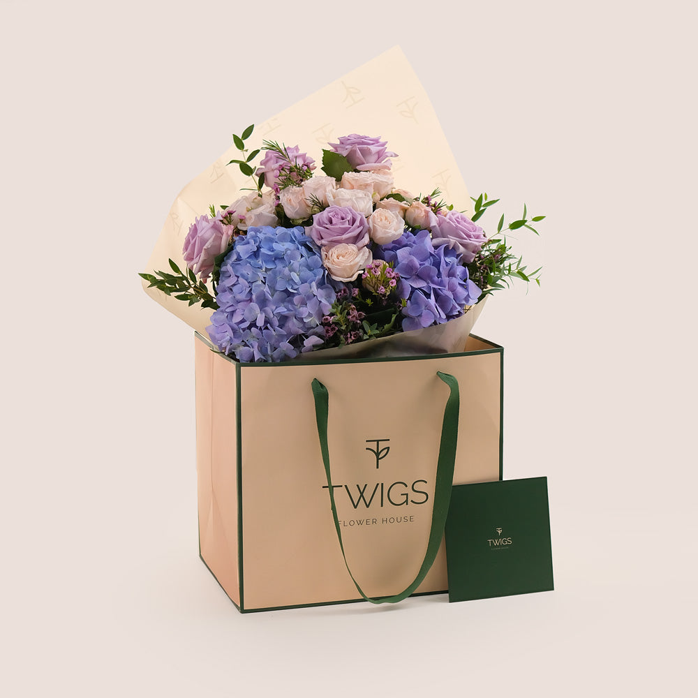 Purple Hydrangea & Rose Hand Bouquet – Soft Elegance in a Chic Flower Gift Bag