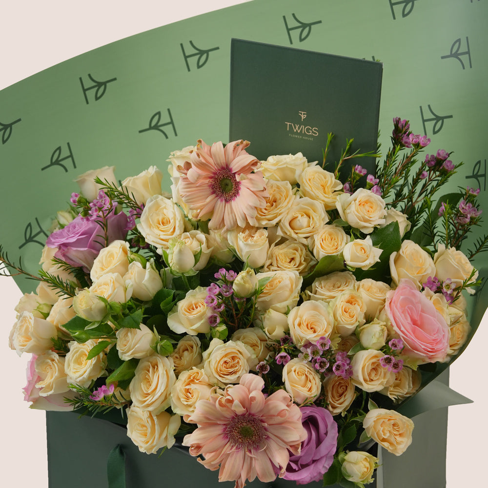 Peach Harmony Mother’s Day flower arrangement with peach gerberas and roses in TWIGS signature flower bag