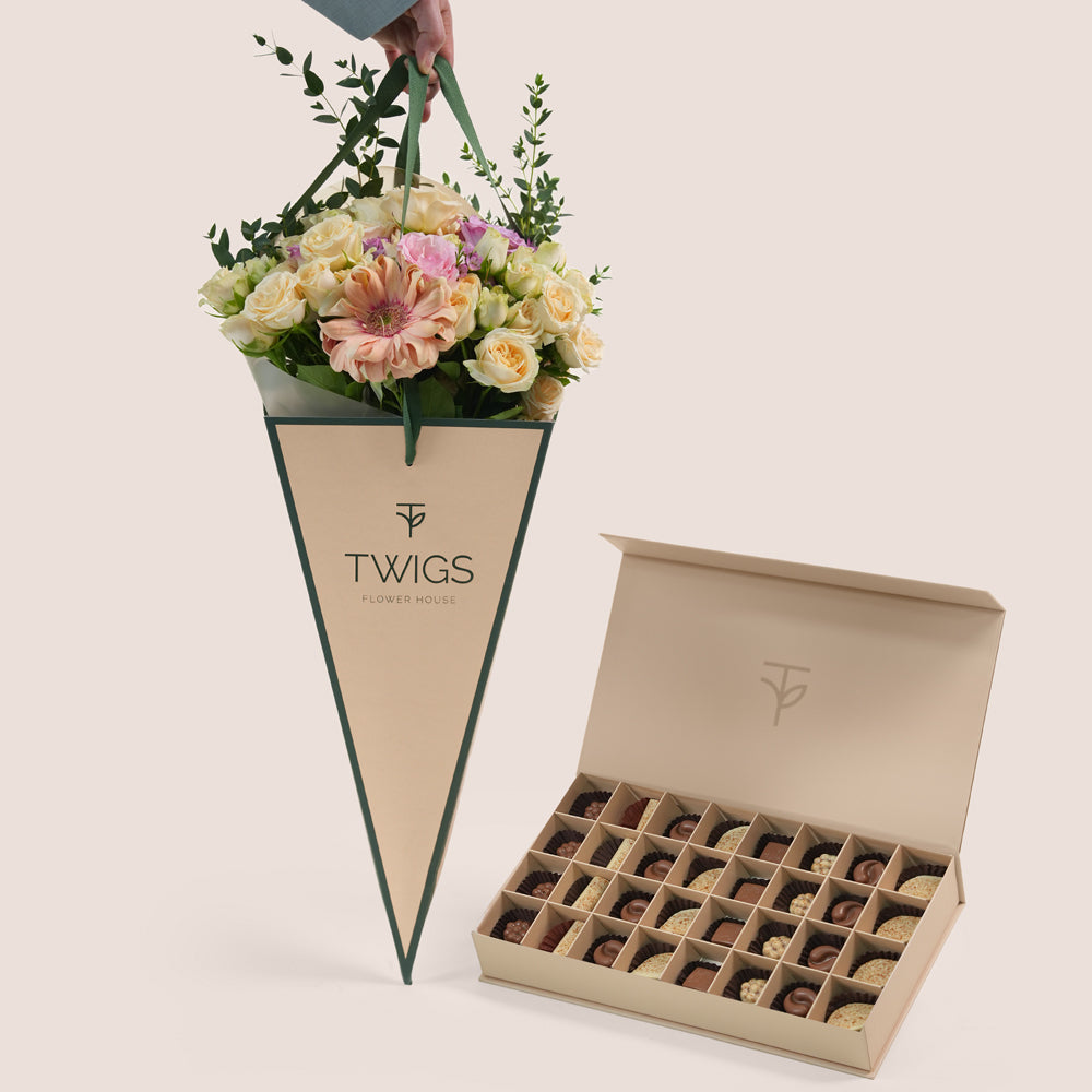 Peach Harmony flower arrangement in TWIGS cone bag paired with 32 piece premium chocolate gift box