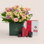 Mother’s Day flower arrangement with peach gerberas and roses in TWIGS square box paired with Rituals Ayurveda gift set