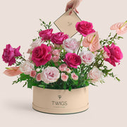 Blush anthurium and pink rose grande round flower box by TWIGS in beige