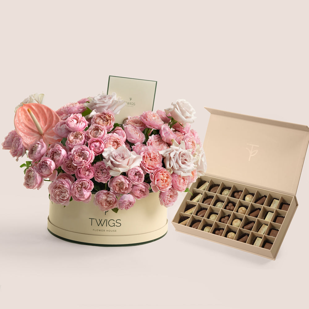 Juliet and Quicksand rose Grande beige round box with TWIGS premium chocolate assortment — same-day Eid gift delivery UAE
