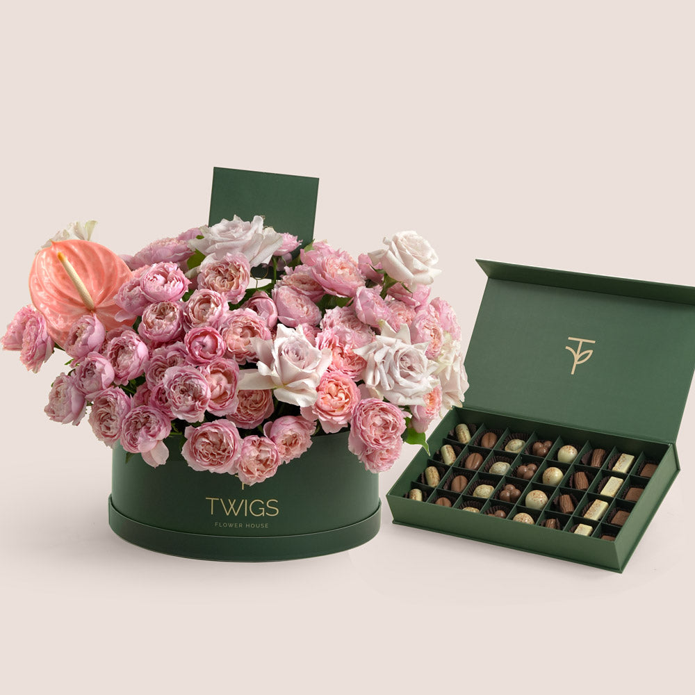 Juliet and Quicksand rose Grande beige round box with TWIGS premium chocolate assortment — same-day Eid gift delivery UAE
