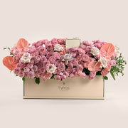 Wide blush and pink garden rose arrangement in TWIGS beige garden box — same-day Eid flower delivery UAE