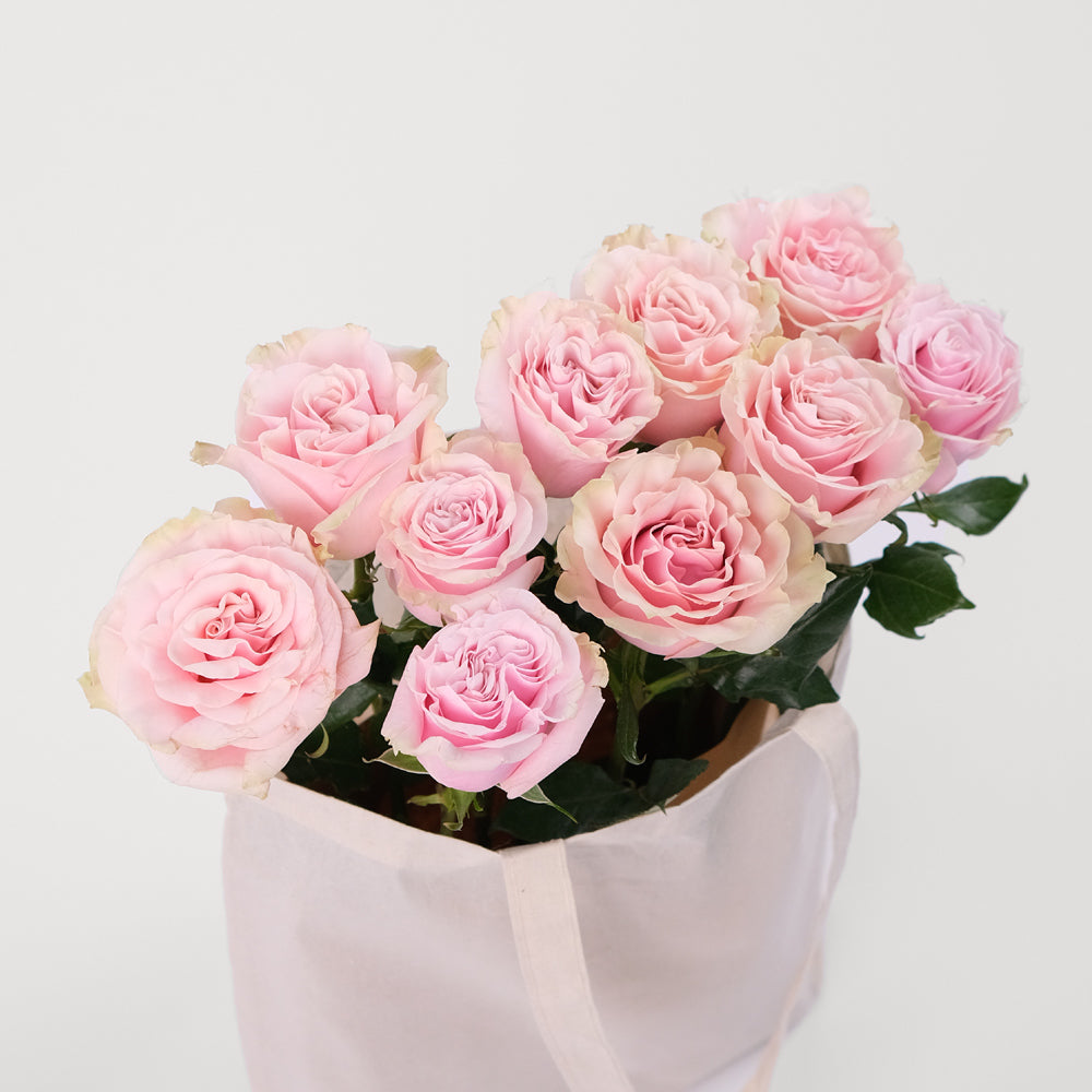 Pink Mondial Roses in a Reusable Canvas Tote – Timeless Beauty with a Modern Touch