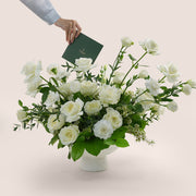premium flower arrangement in white ceramic vase 
