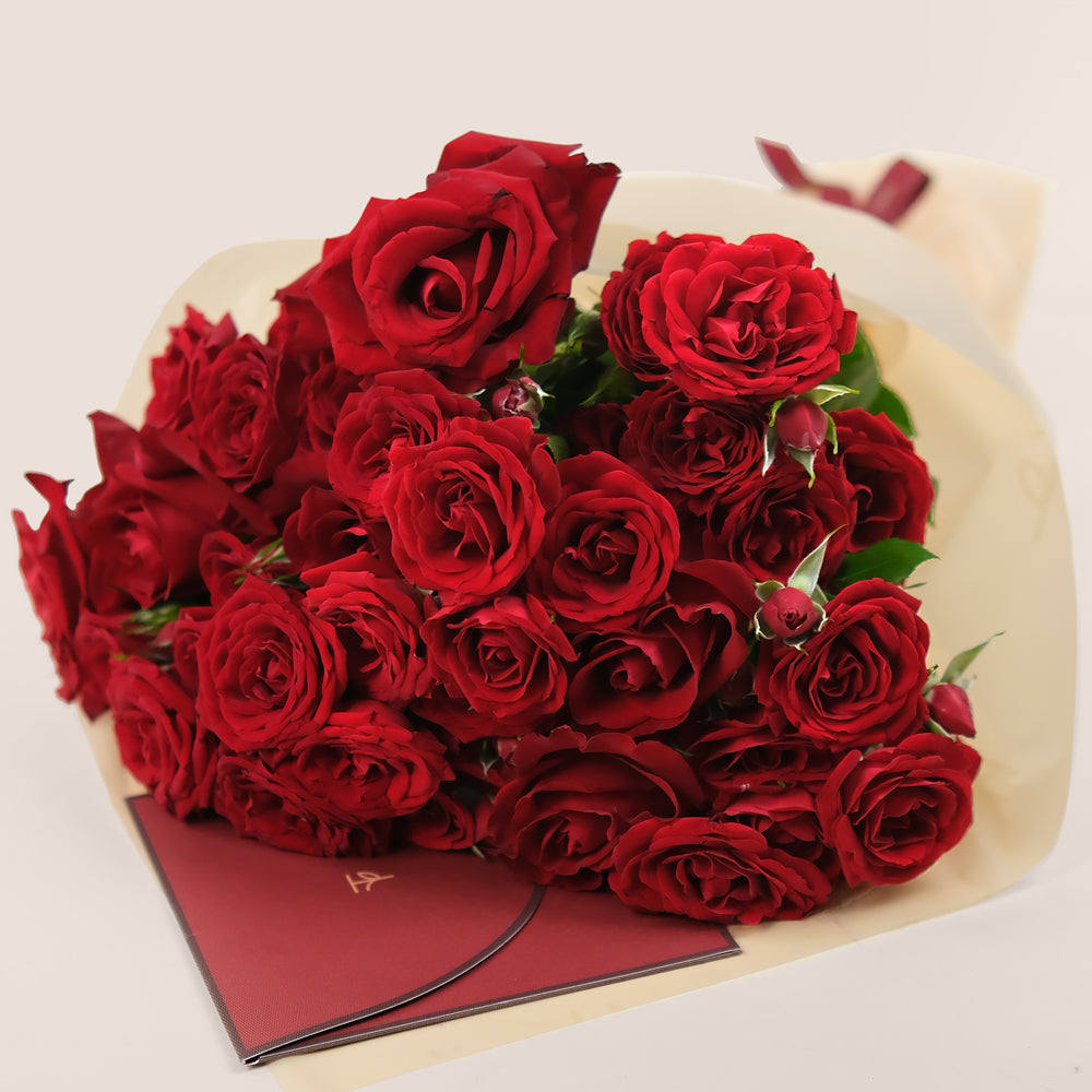 Premium red roses cone bag gift with modern wrapping in Dubai
