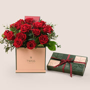 أناقة عيد الحب – ورود حمراء وعلبة شوكولاتة فاخرة