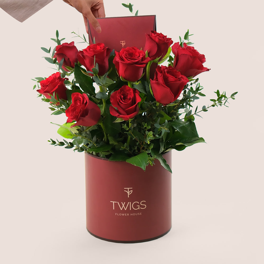 A Dozen Red Roses in Limited Edition Burgundy Round Box
