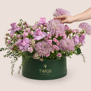 Emirati Women's Day lavender roses and purple chrysanthemums arranged in a TWIGS Grande round box, Green and Beige options
