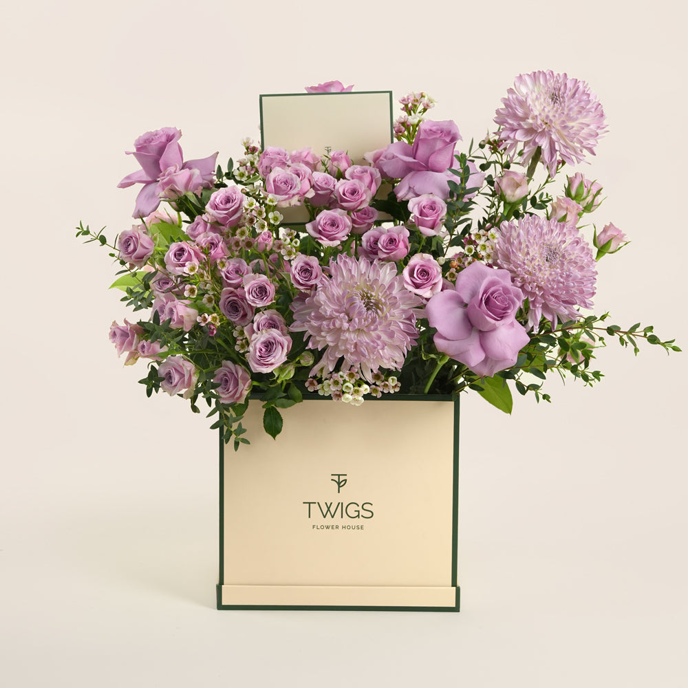 Emirati Women's Day lavender roses and purple chrysanthemums arranged in a TWIGS square flower box, Green and Beige options