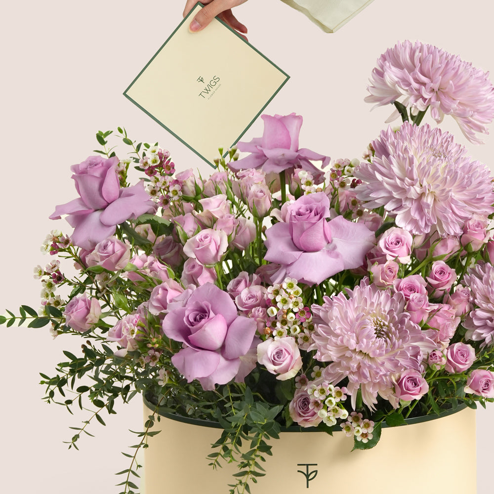 Emirati Women's Day lavender roses and purple chrysanthemums arranged in a TWIGS Grande round box, Green and Beige options