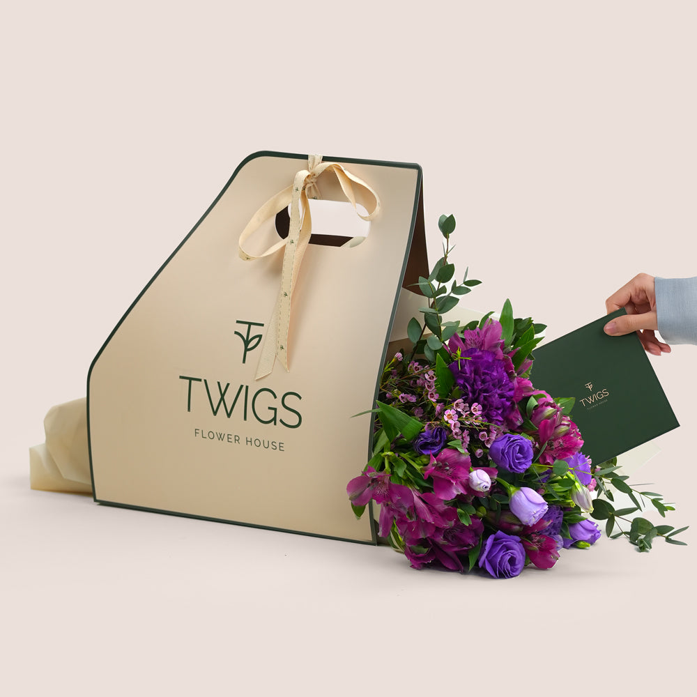 Floral arrangement with a Twigs Flower House bag and card 