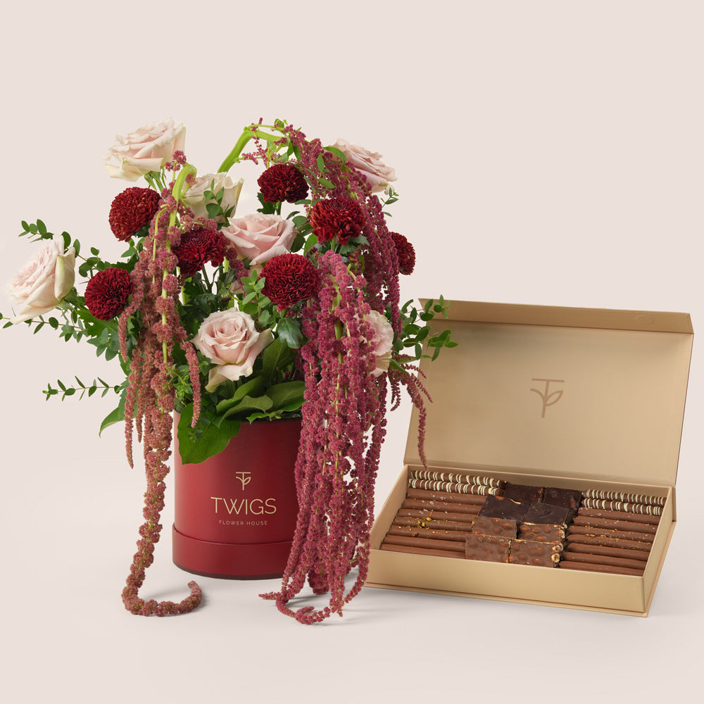Luxury Ramadan flower arrangement with Quicksand roses and burgundy chrysanthemums paired with TWIGS chocolate gift box – UAE same-day delivery
