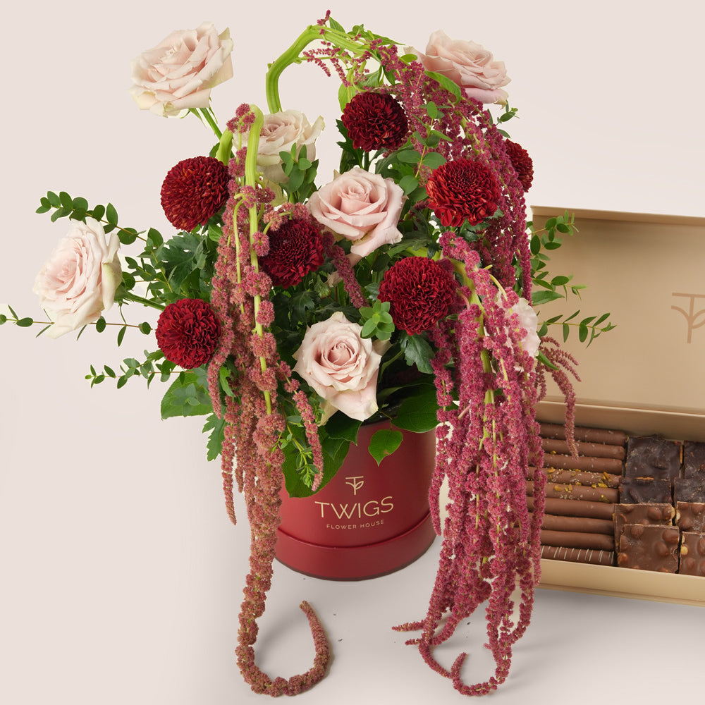 Luxury Ramadan flower arrangement with Quicksand roses and burgundy chrysanthemums paired with TWIGS chocolate gift box – UAE same-day delivery