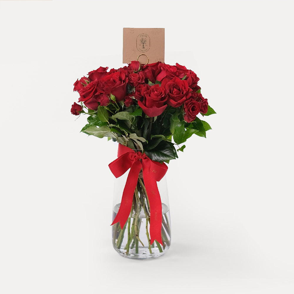 Red roses in vase Dubai same day flower delivery