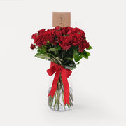 Red roses in vase Dubai same day flower delivery