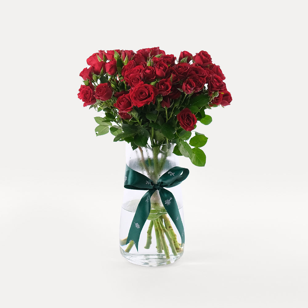 Red roses in vase Dubai same day flower delivery