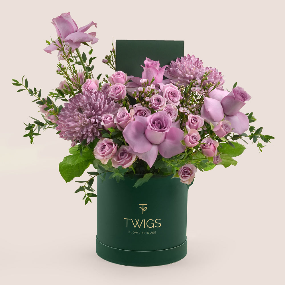Emirati Women's Day lavender roses and purple chrysanthemums arranged in a TWIGS Deluxe round box, Green and Beige options
