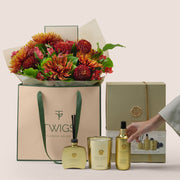 Ruby Eid flower arrangement in TWIGS gift bag with Rituals Sakura gift set Dubai