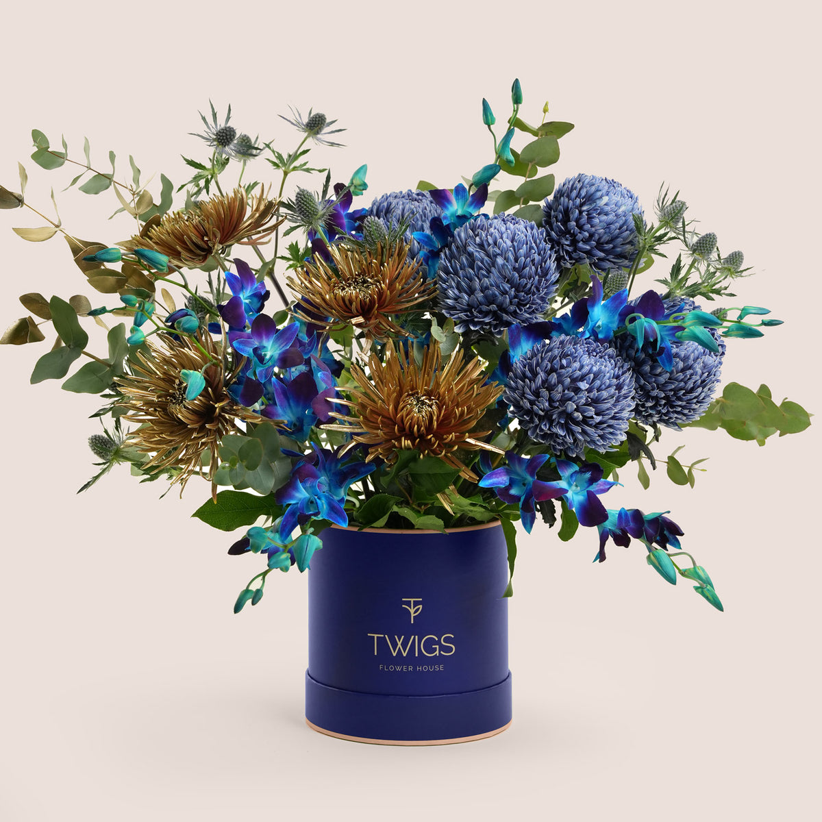 Blue orchids, blue chrysanthemums and bronze spider mums in a navy TWIGS flower box, a premium Diwali gift delivered in Dubai