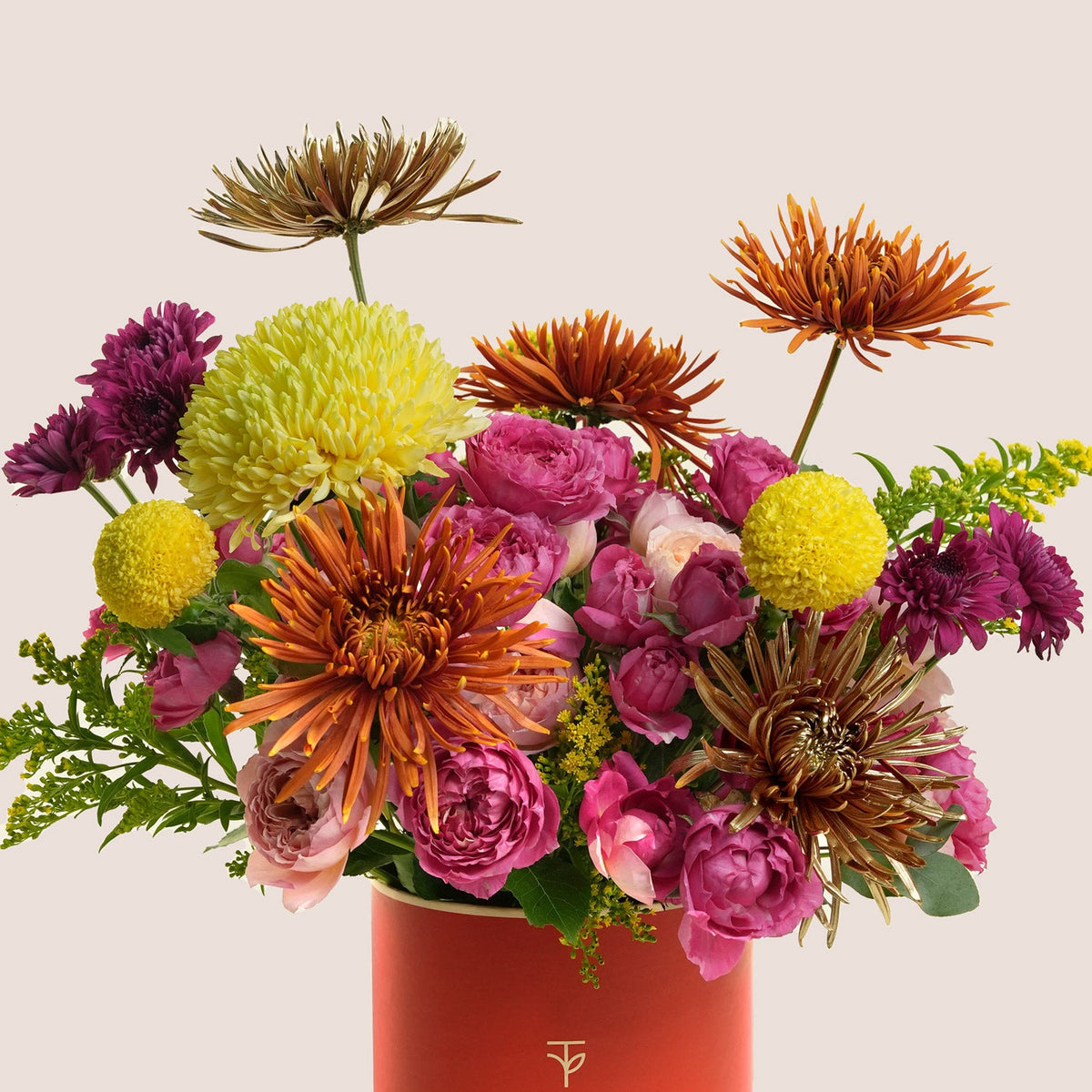 Pink roses, yellow and orange chrysanthemums in an orange TWIGS flower box, a colourful Diwali flower gift delivered in Dubai