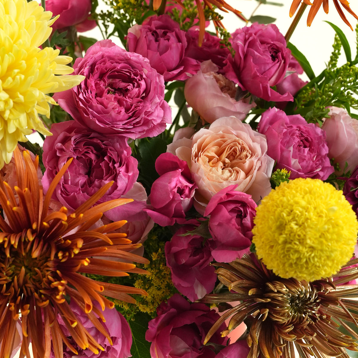 Pink roses, yellow and orange chrysanthemums in an orange TWIGS flower box, a colourful Diwali flower gift delivered in Dubai