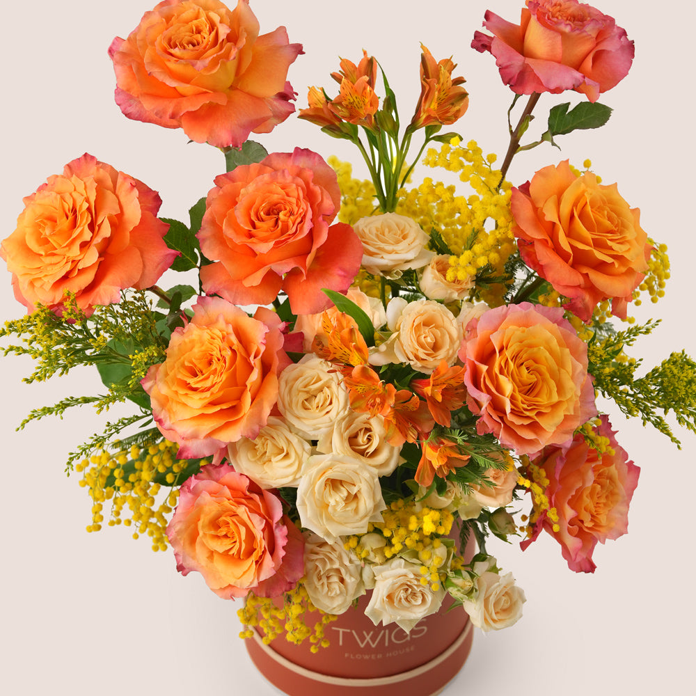 Luxury Ramadan flower arrangement with orange Ecuador roses and spray roses paired with Rituals Sweet Jasmine candle and fragrance gift set – UAE delivery