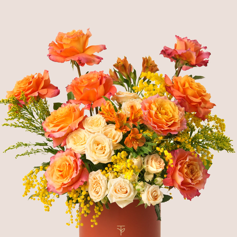 Luxury Ramadan flower arrangement with orange Ecuador roses paired with TWIGS signature chocolate gift box – UAE same-day delivery