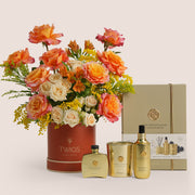 Luxury Ramadan flower arrangement with orange Ecuador roses and spray roses paired with Rituals Sweet Jasmine candle and fragrance gift set – UAE delivery