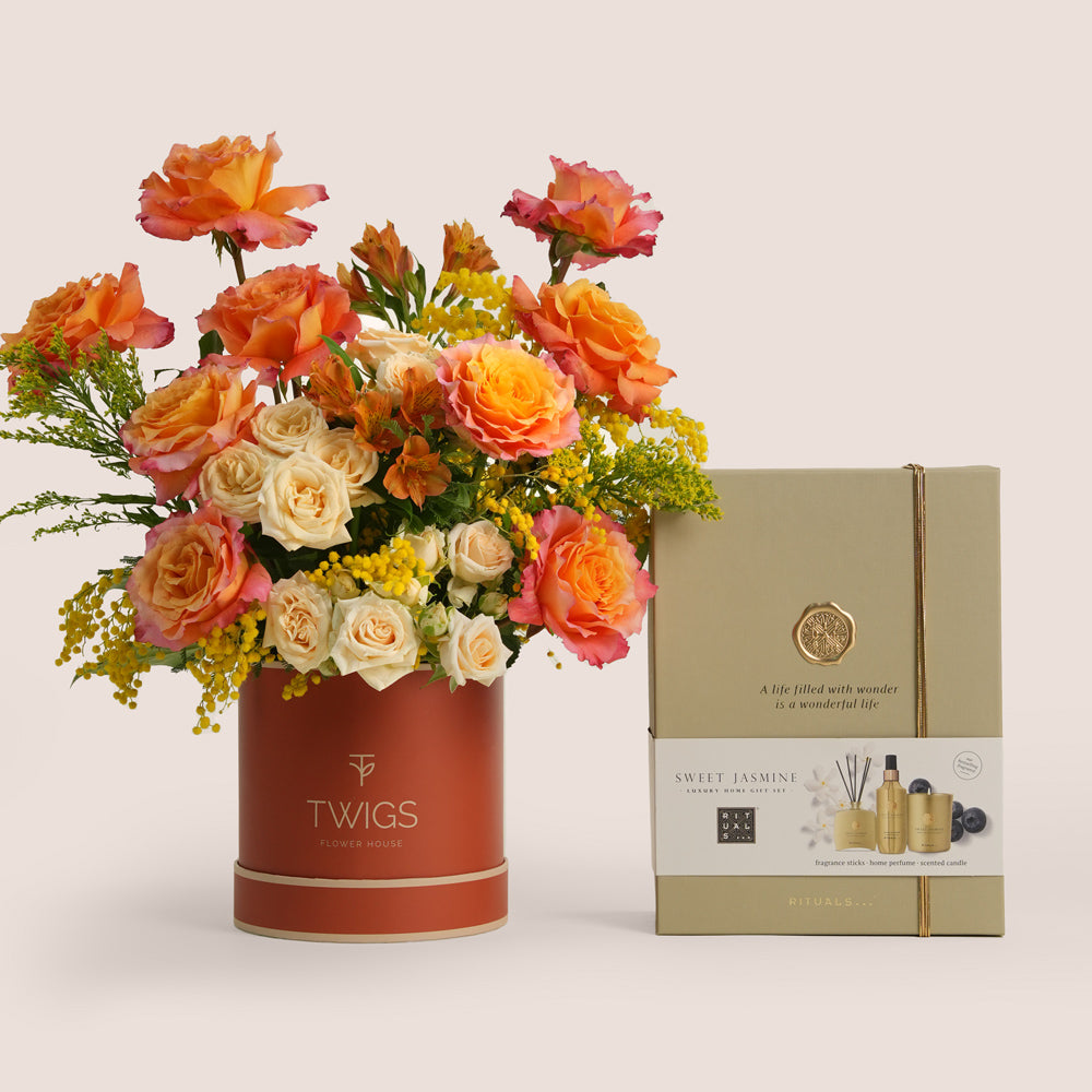 Luxury Ramadan flower arrangement with orange Ecuador roses and spray roses paired with Rituals Sweet Jasmine candle and fragrance gift set – UAE delivery