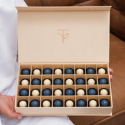 Midnight Bonbons — 32 handcrafted blue and ivory chocolate bonbons in TWIGS signature cream box, gift add-on Dubai