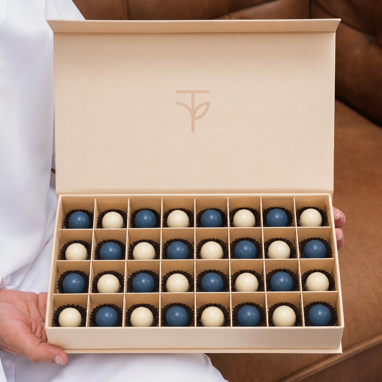 Midnight Bonbons — 32 handcrafted blue and ivory chocolate bonbons in TWIGS signature cream box, gift add-on Dubai