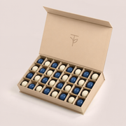 Midnight Bonbons — 32 handcrafted navy and ivory chocolate bonbons in TWIGS signature cream box, gift add-on Dubai