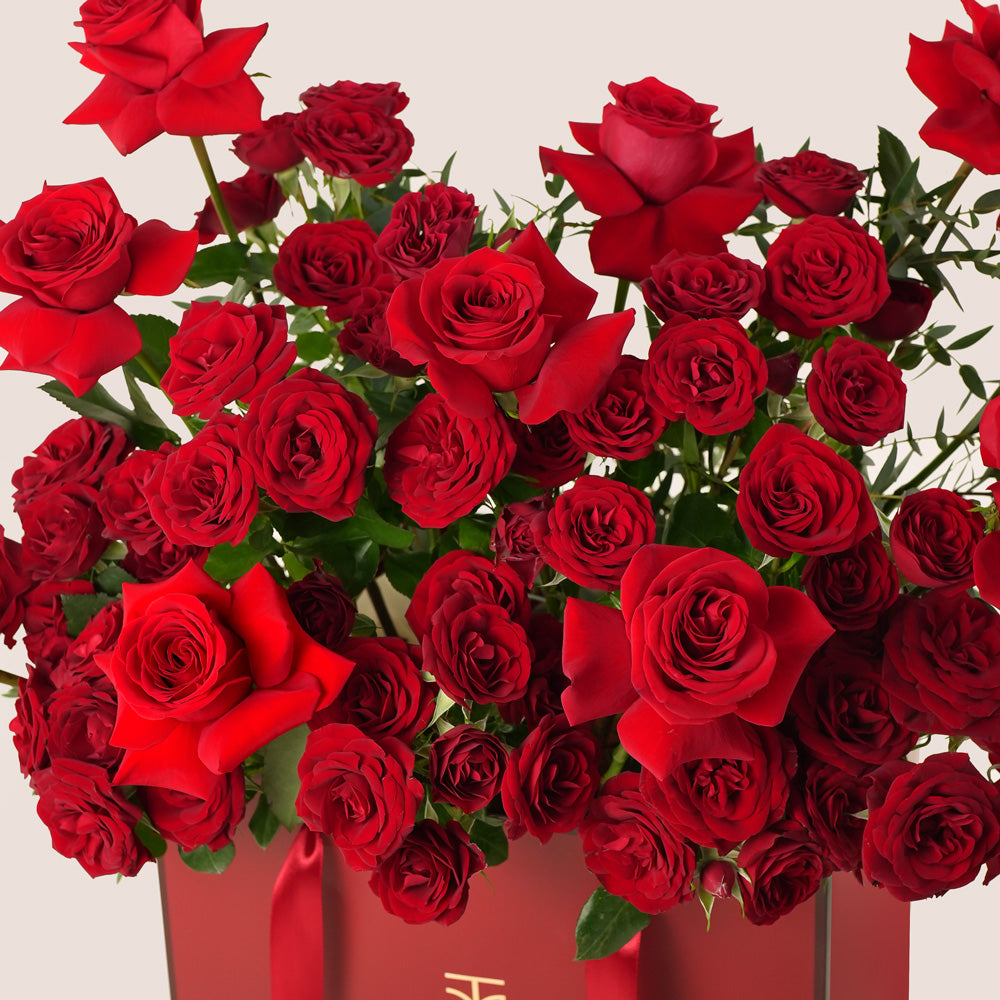 Premium Red Roses Bouquet in Burgundy Gift Bag – Valentine’s Day Flower Delivery in UAE