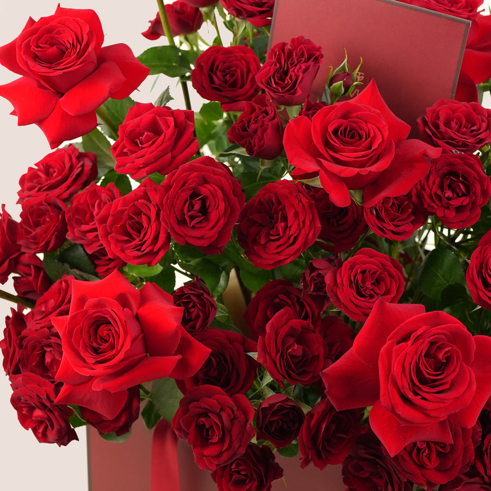 Red Roses Bouquet in Burgundy Bag with Balloons & Chocolates – Valentine’s Day Flower Delivery in UAE